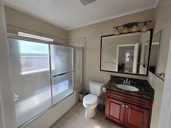 Bathroom with Italian marble vanity with full shower & tub.