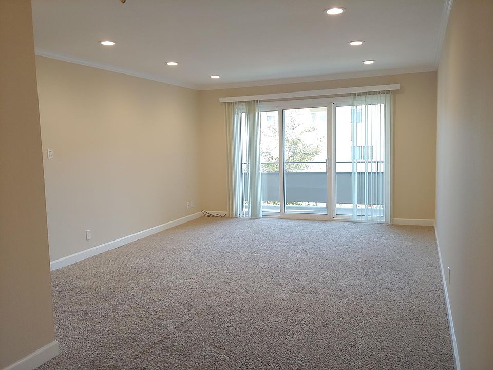 Living room with recessed lights on a dimmer switch.