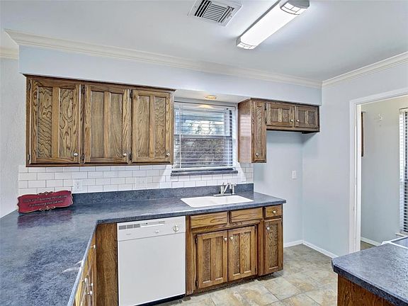more natural light makes cooking in this kitchen an enjoyable experience.