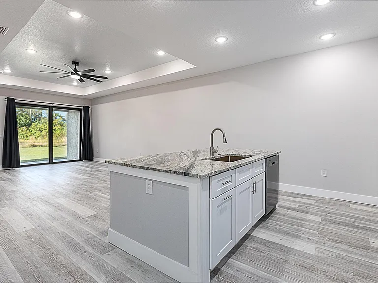 LED lighting, ceiling fans in each room. Beautiful coffer ceiling in the living room