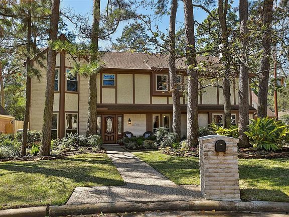 PARK LIKE FRONT YARD WITH PROFESSIONALLY MAINTAINED LANDSCAPING