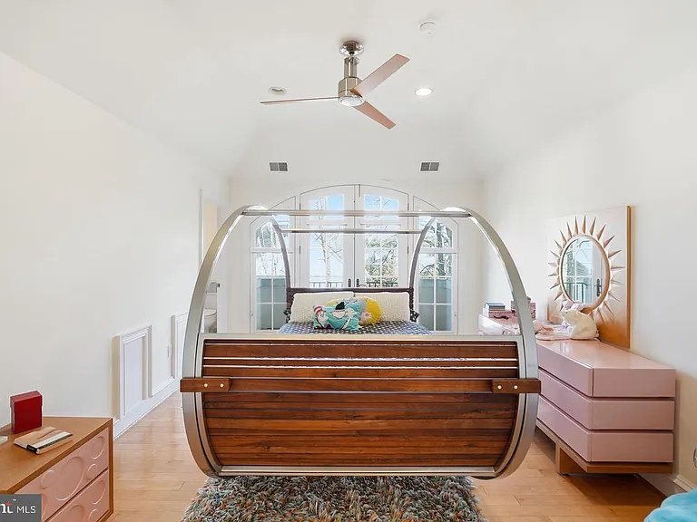 Charming swing bed in bright retreat.