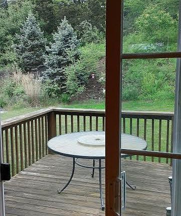 Spacious outside deck and storage unit with a beautifully landscaped yard that is maintained as part of your monthly rent.