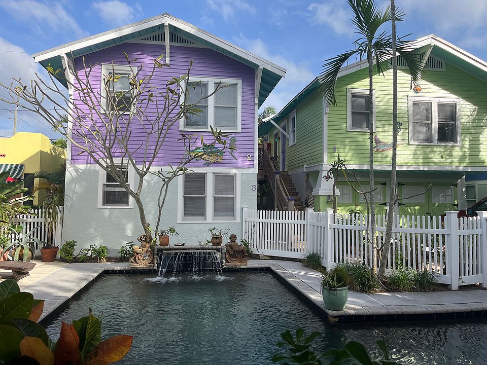 Exterior from pool/ Downstairs apt