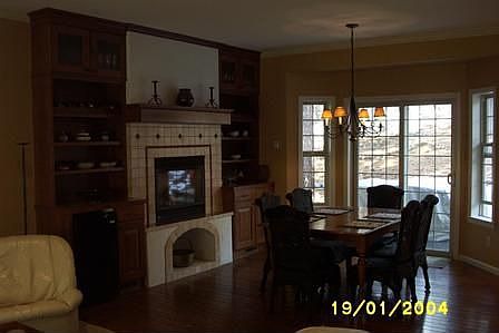 custom fireplace with cabinets, dry bar