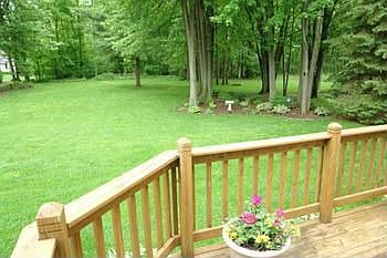 Mature trees, custom landscaping, deep lot with lots of wild animals and room for family or get toge