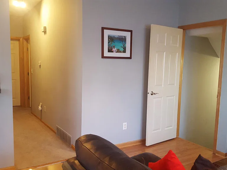 Hallway and door leading downatairs