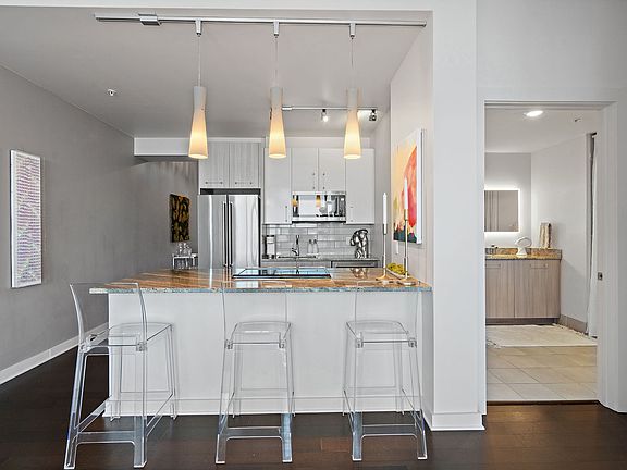 Looking from living room towards kitchen. Door on right is guest bath.