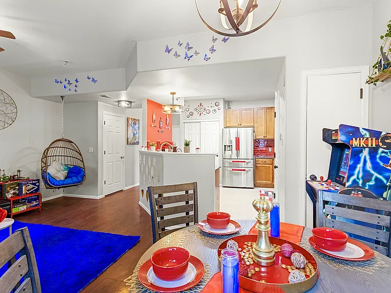 Spacious and open-concept living area with a cozy sitting nook and a fully equipped kitchen. Perfect for entertaining guests or enjoying a quiet night in.