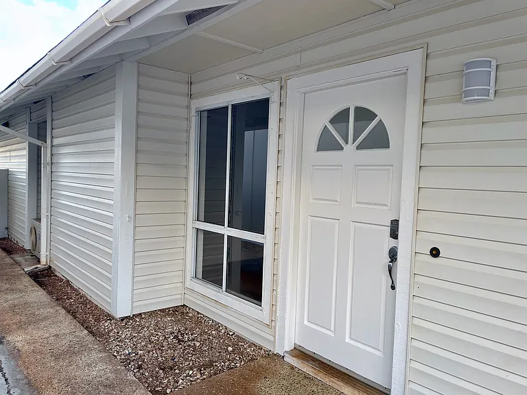 Private side entrance front door with keyless entry.