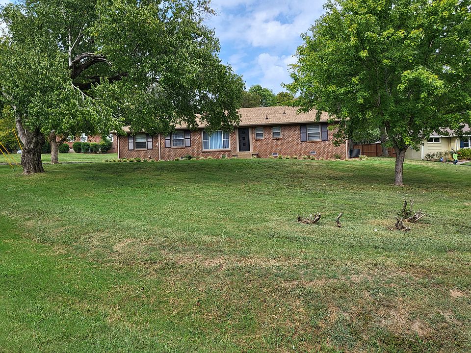 Front Yard with mature trees facing east.