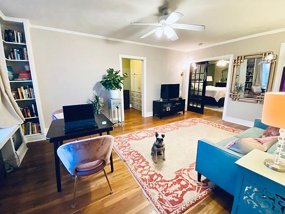 View from front door, window seat and built-in bookcase on left