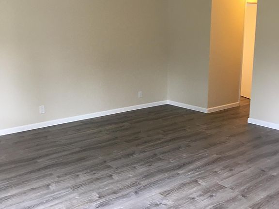 Living room leads to half bath and linen closet