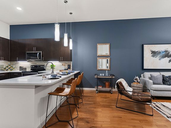 Interior finishes include concrete or luxury vinyl plank flooring and two-tone paint