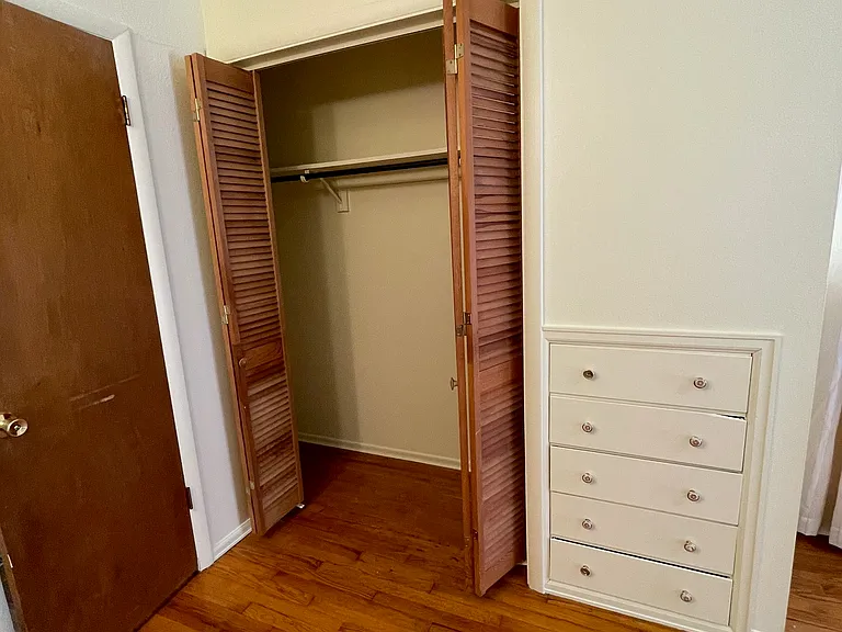 Third bedroom closet and built in dresser.