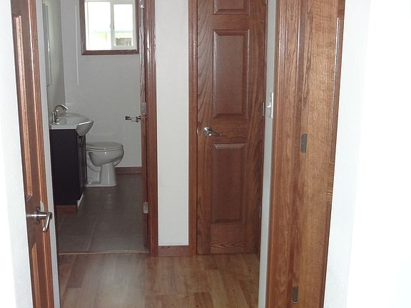 hallway with 2 linen closets