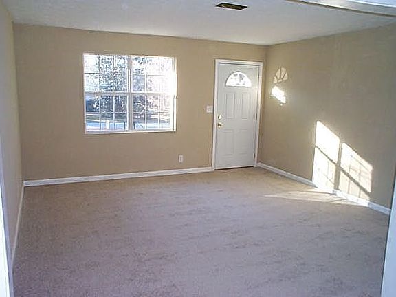 Big Family Rm is flooded with light. Notice the new carpet and paint throughout.