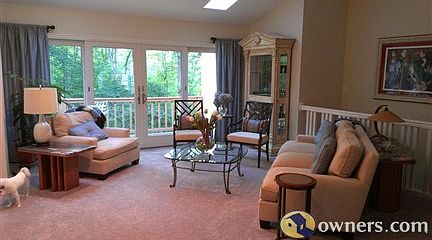 Main level living room and sliders to deck