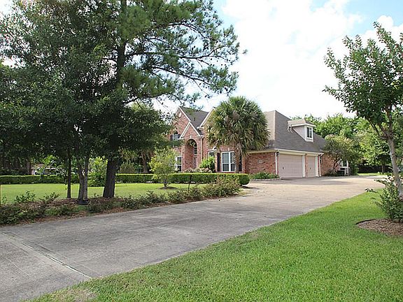 View leading to Driveway and three car Garage.