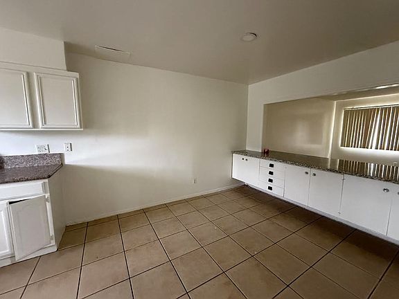 Huge Kitchen with a breakfast counter space and lots of storage cabinets