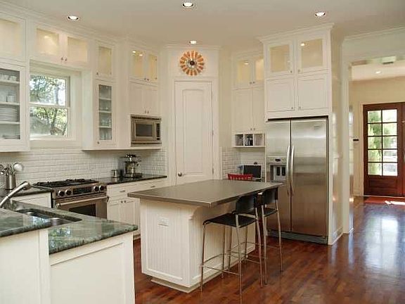Kitchen - Island for visiting while cooking, custom lighted cabinetry, compute