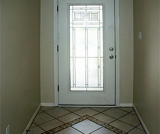 Custom tile entryway greets guests with style