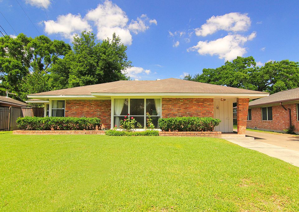 One story ranch home with 2 car garage, carport, and double wide driveway.