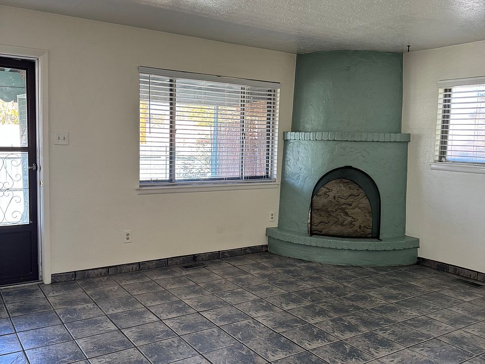 Living Area with wood burning Kiva Fireplace