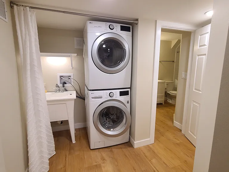Stacked washer and dryer and utility sink