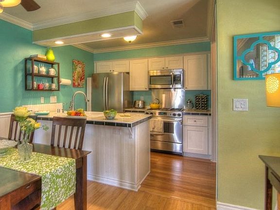 Generous Dining Area adjoins kitchen. Note the breakfast/wine bar, and recessed lighting.