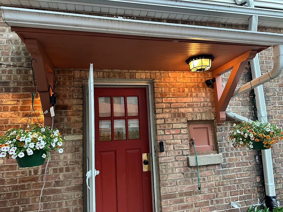 Side entrance to house, apartment entry and basement access.