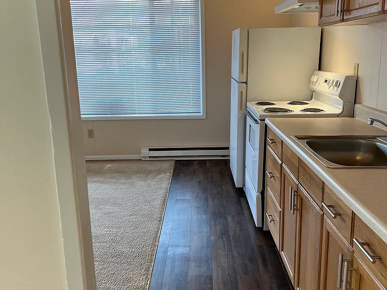 Kitchen from bed and bath