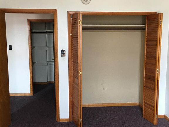 Closet in bedroom as well as large walk-in in hallway