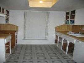 Kitchen (cabinets are ready for new paint in the garage)