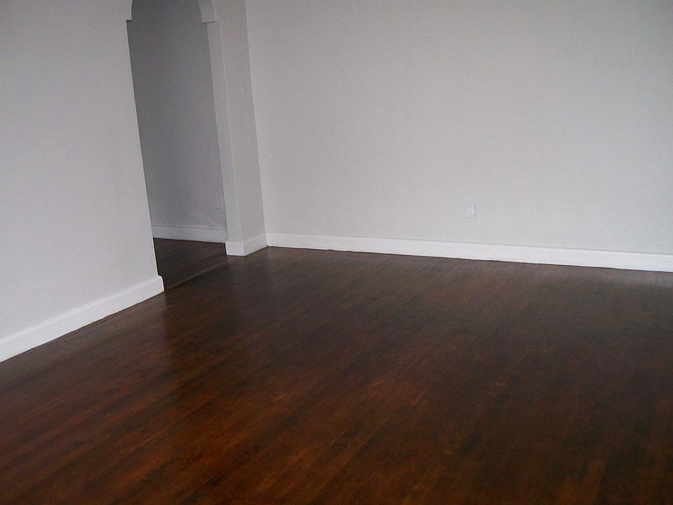 LARGE living room with newly refurbished hardwood floors.