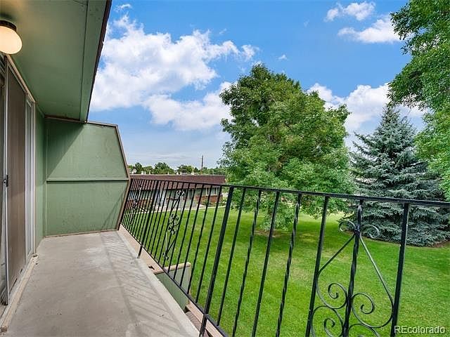 Large balcony overlooks beautiful courtyard