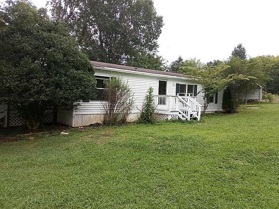 Front of House with Carport 