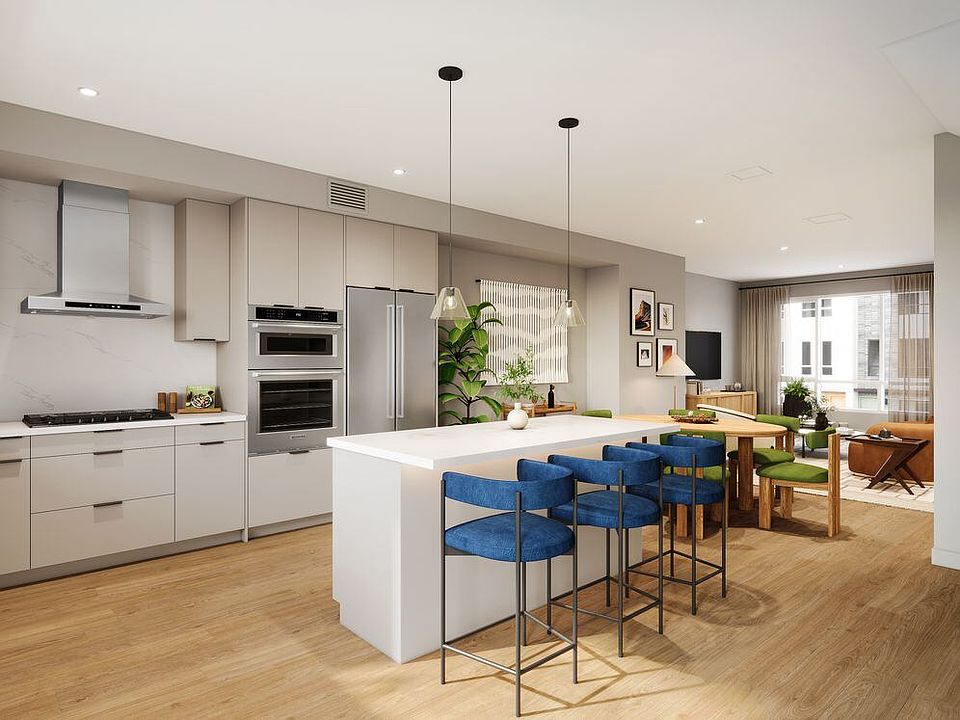 Signature Collection I 4-Bedroom Townhome kitchen with upgraded stainless steel appliances, pendant lighting, and more (Rendering)