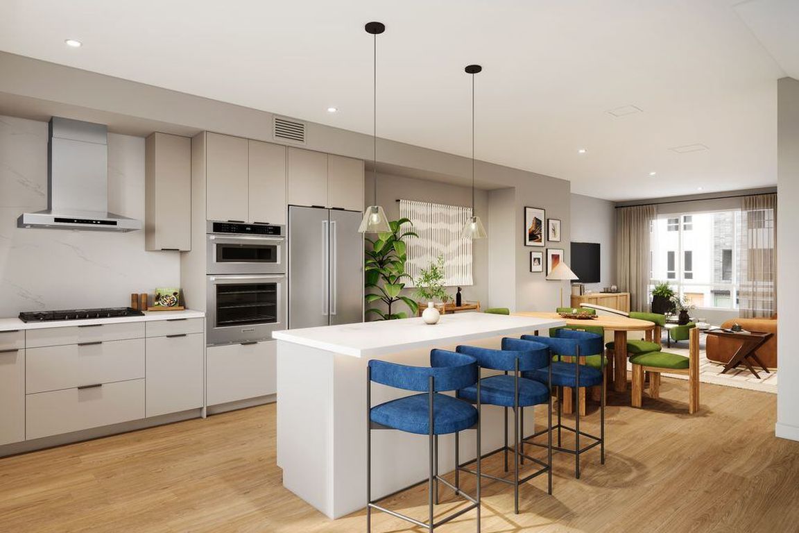 Signature Collection I 4-Bedroom Townhome kitchen with upgraded stainless steel appliances, pendant lighting, and more (Rendering)