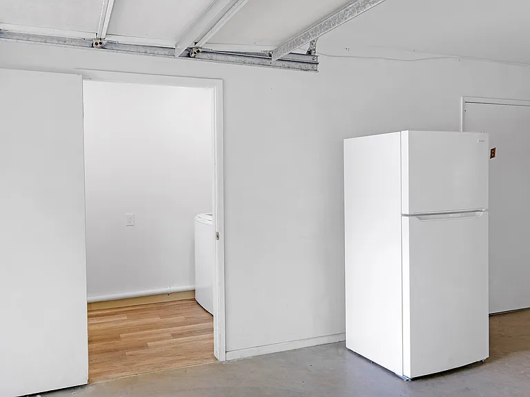 Second refrigerator in garage.