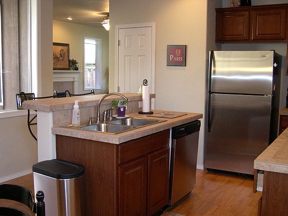 Cherry Cabinets, Stainless Steel Appliances & Tile Counters