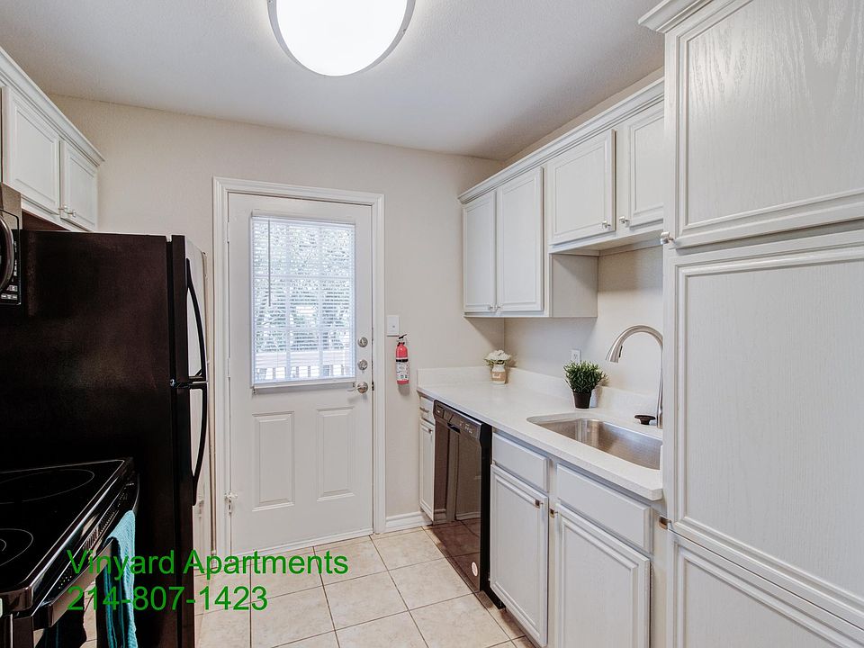 Sink side of the kitchen with gooseneck faucet