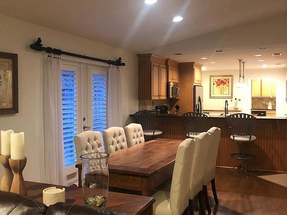 Dining area with access to side patio with grill and ping pong table. Also enjoy eating al fresco on the patio in the back yard!