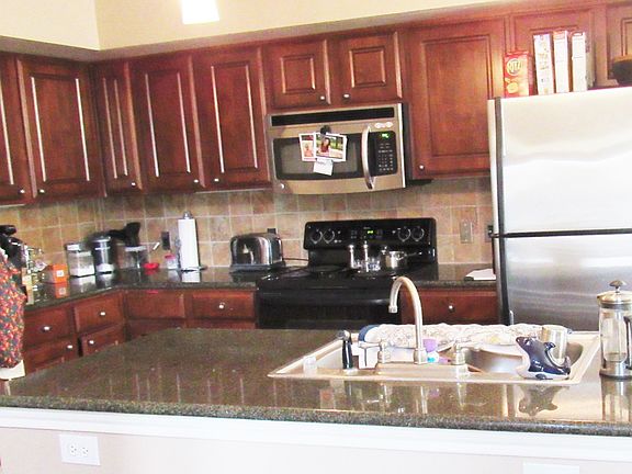Kitchen with granite countertops and stainless steel applian