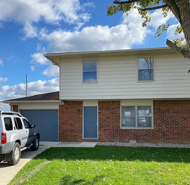 Front of duplex with attached garage