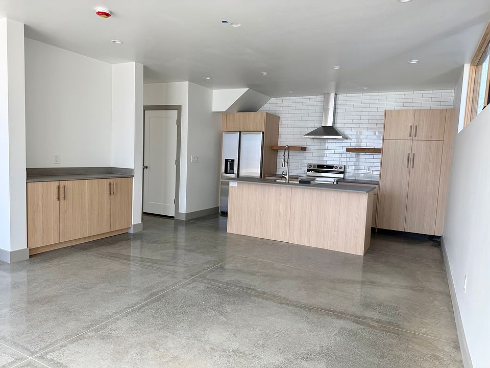 Open concept living area. Kitchen well suited for cooking and entertaining.