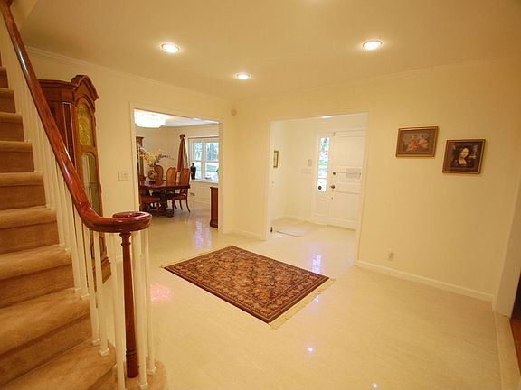 Foyer - Porcelain tile floor, recessed lights