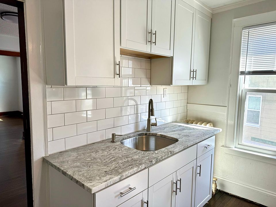 New cabinets, quarts countertop, stainless moen faucet