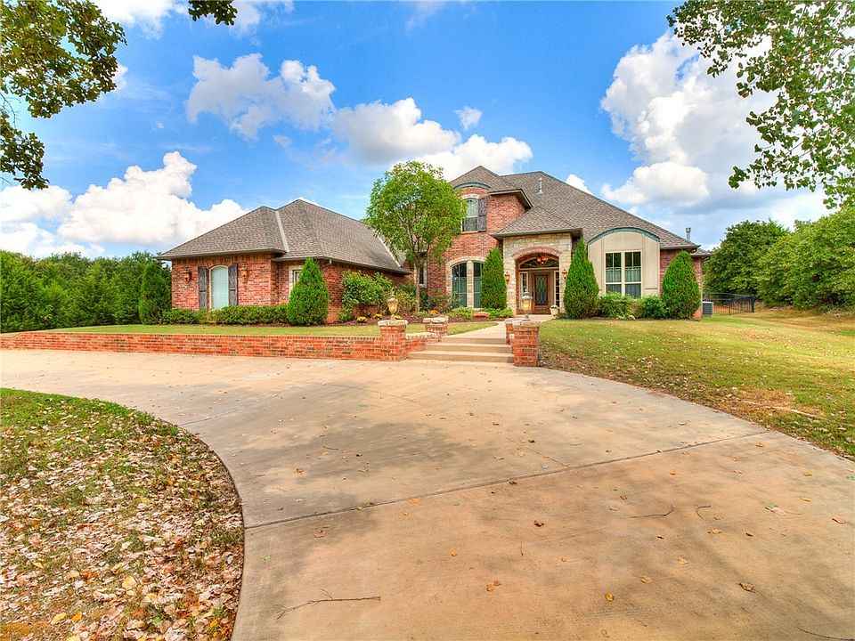 The wooded circle drive leads you to this grand entrance.