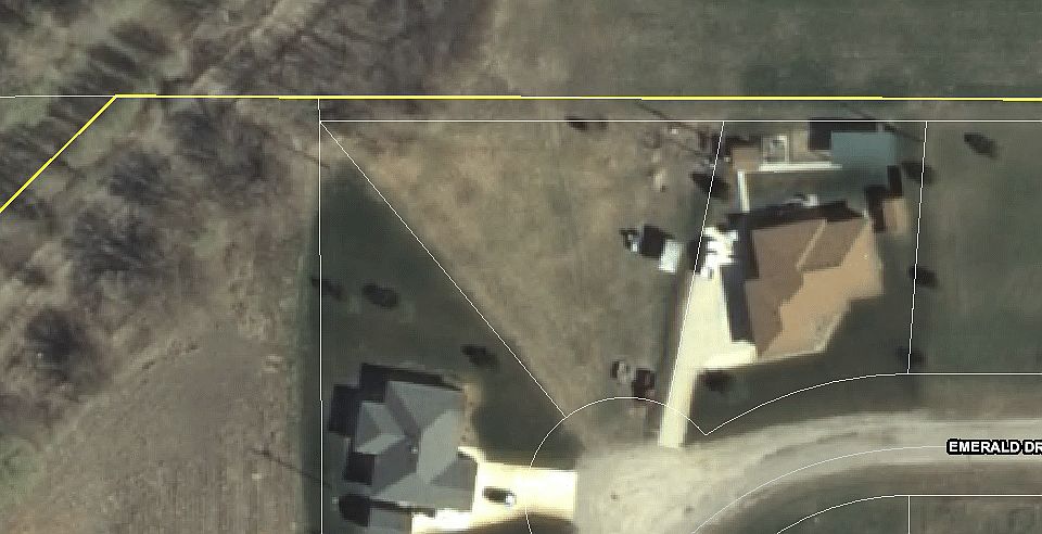 V shaped lot between houses